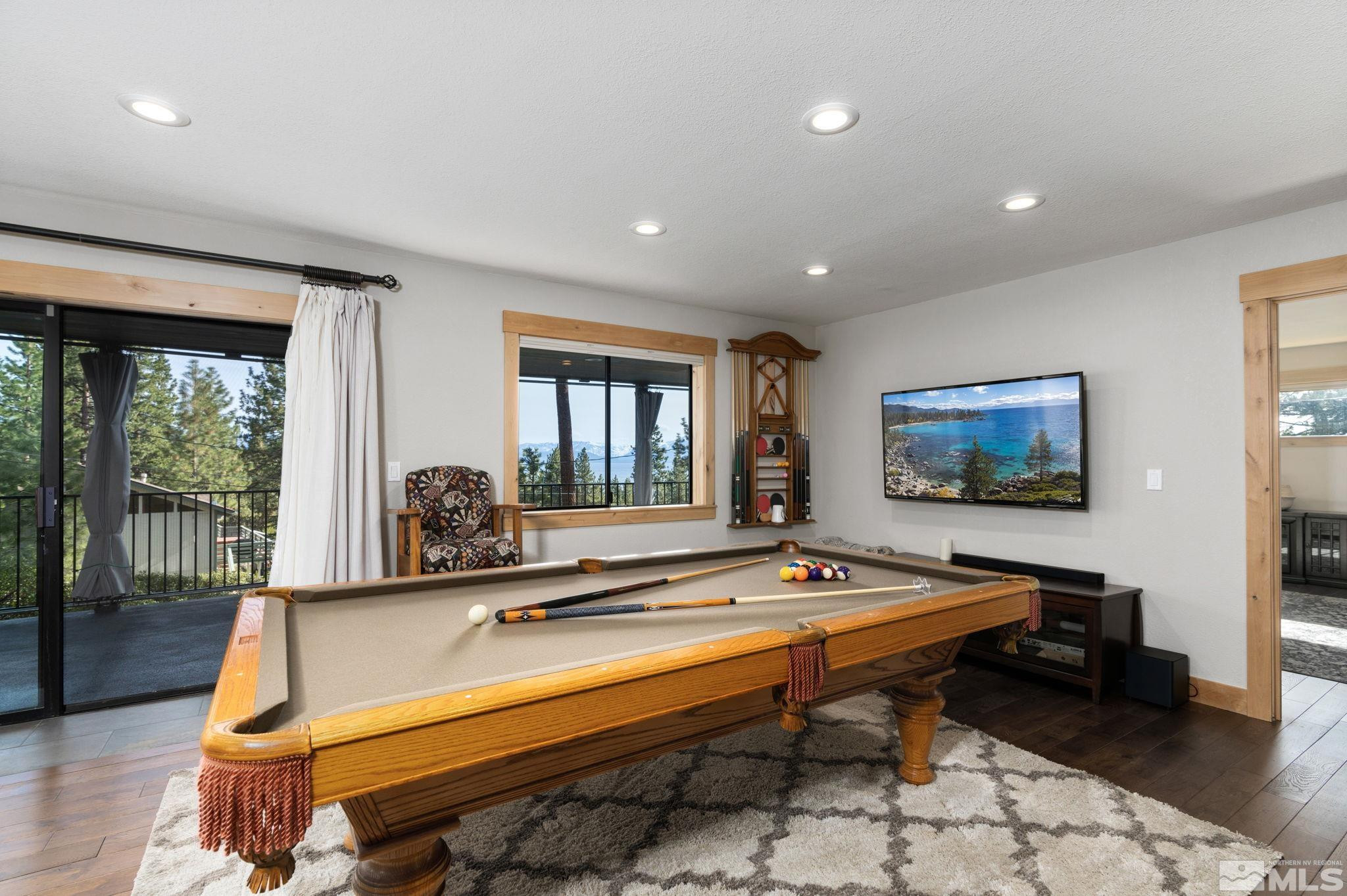 209 Sugar Zephyr Cove, NV 89448 - Photo 25 of 40 a room with pool table and windows