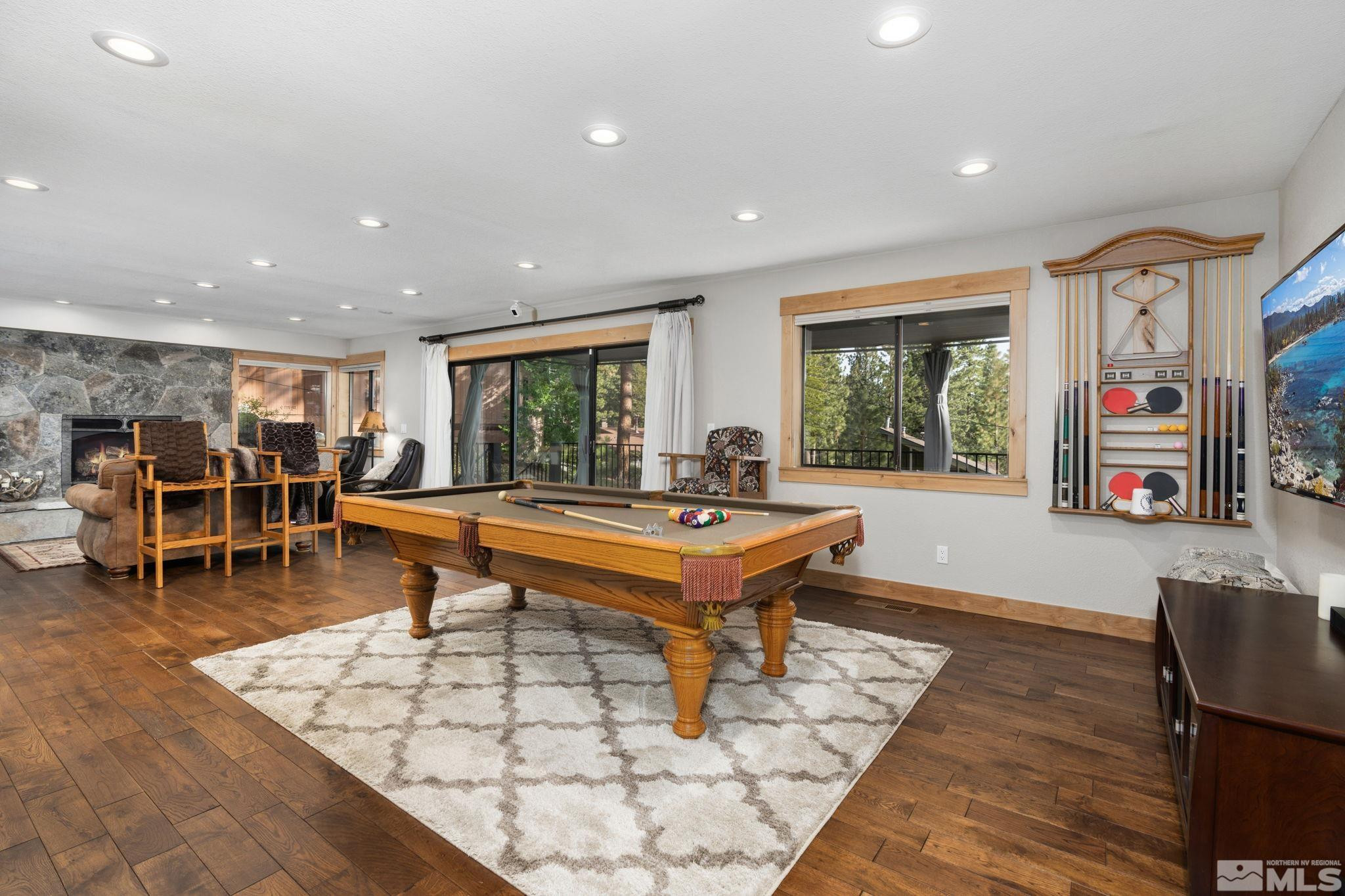 209 Sugar Zephyr Cove, NV 89448 - Photo 26 of 40 a living room with furniture a rug and a flat screen tv