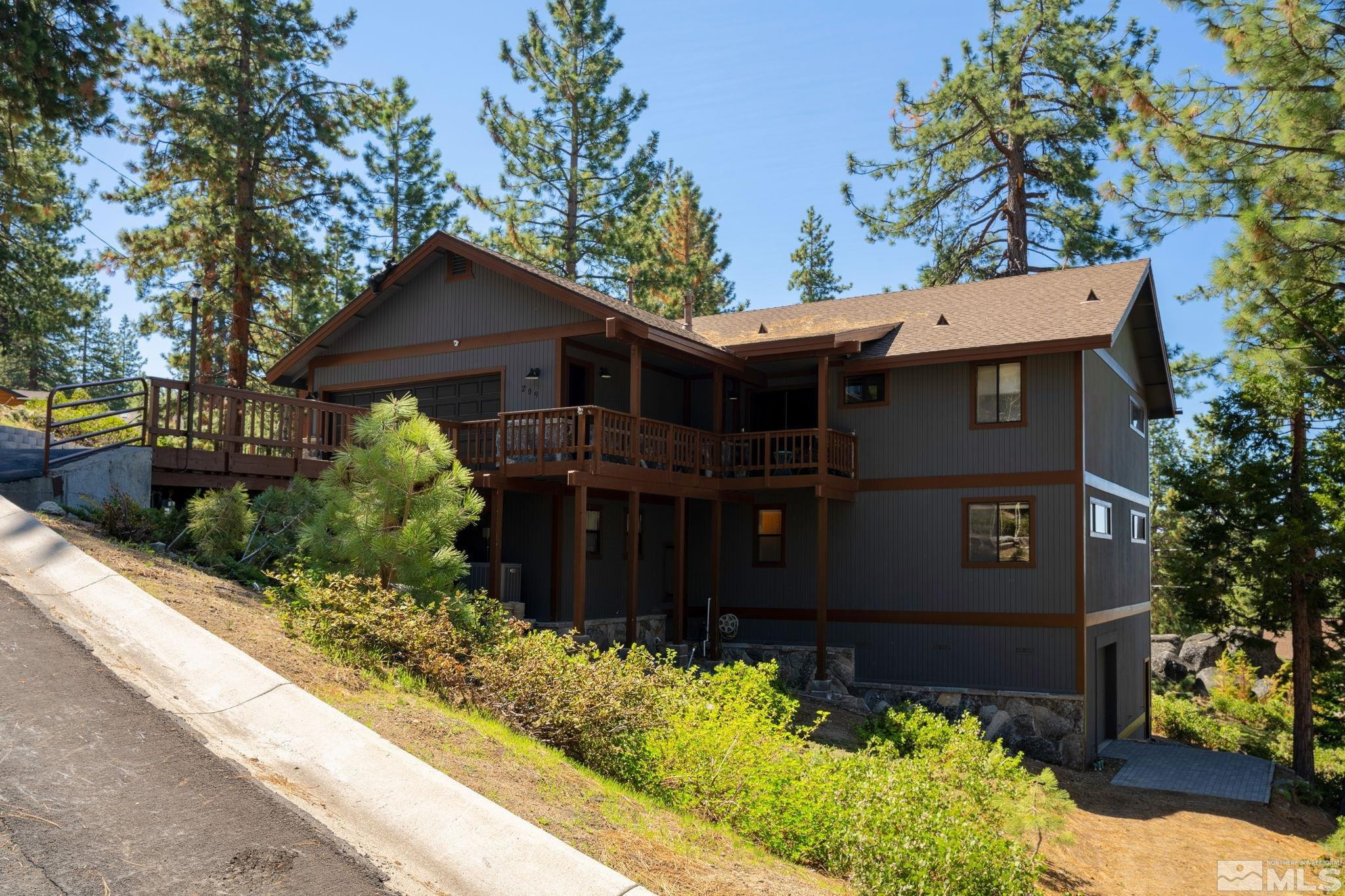 209 Sugar Zephyr Cove, NV 89448 - Photo 3 of 40 front view of a house with a yard