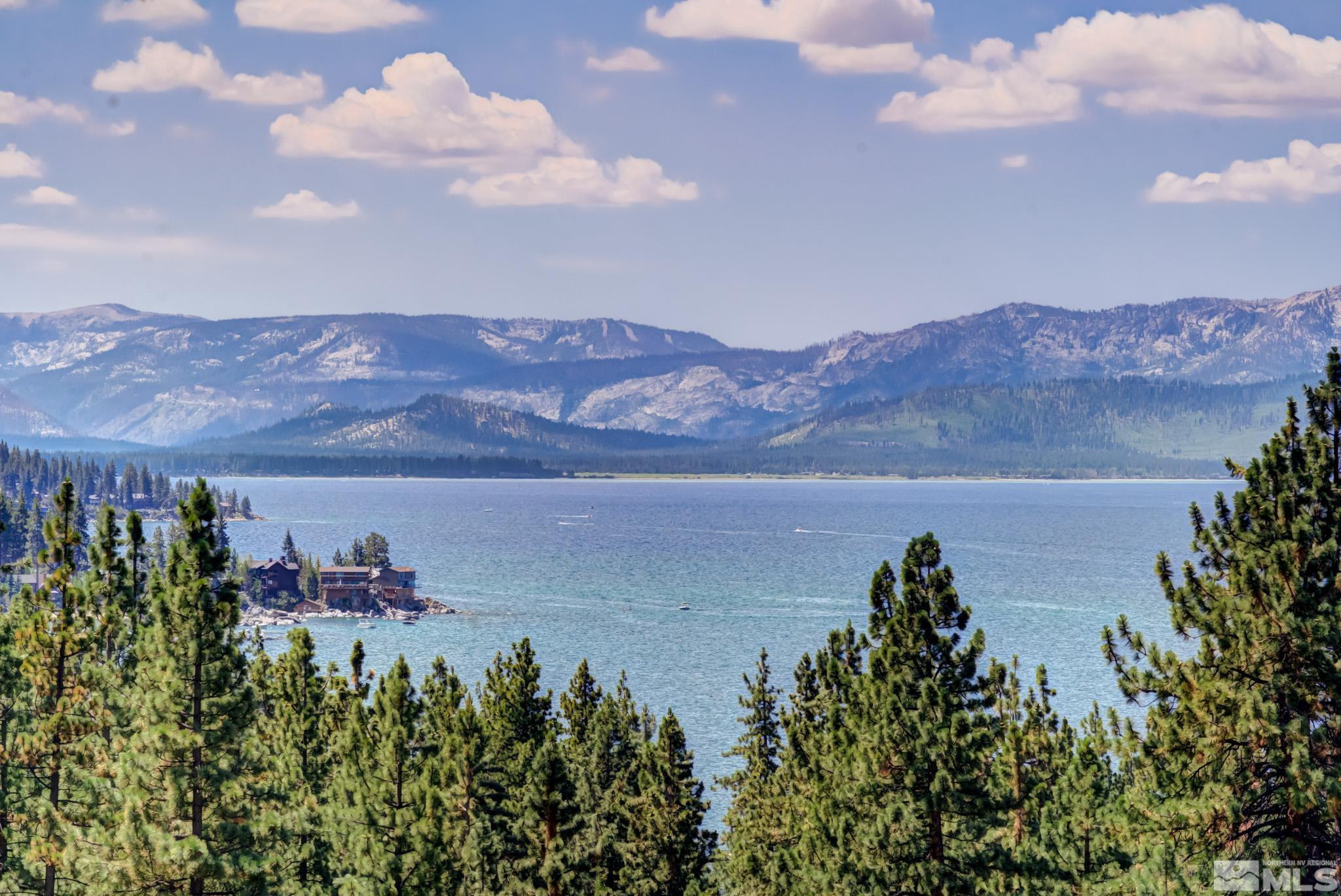 209 Sugar Zephyr Cove, NV 89448 - Photo 5 of 40 a view of a lake with a mountain in the background