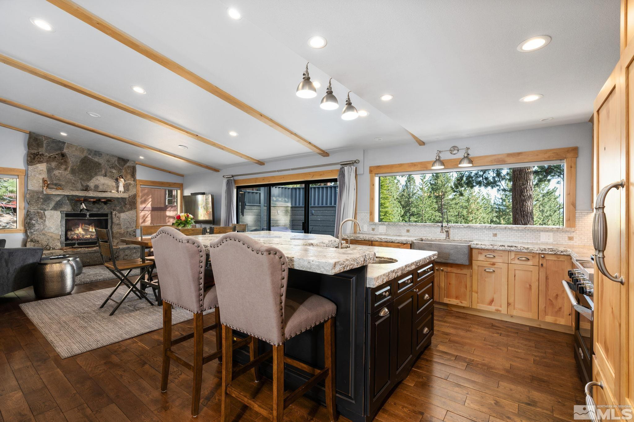 209 Sugar Zephyr Cove, NV 89448 - Photo 8 of 40 a kitchen with stainless steel appliances granite countertop a stove and a refrigerator