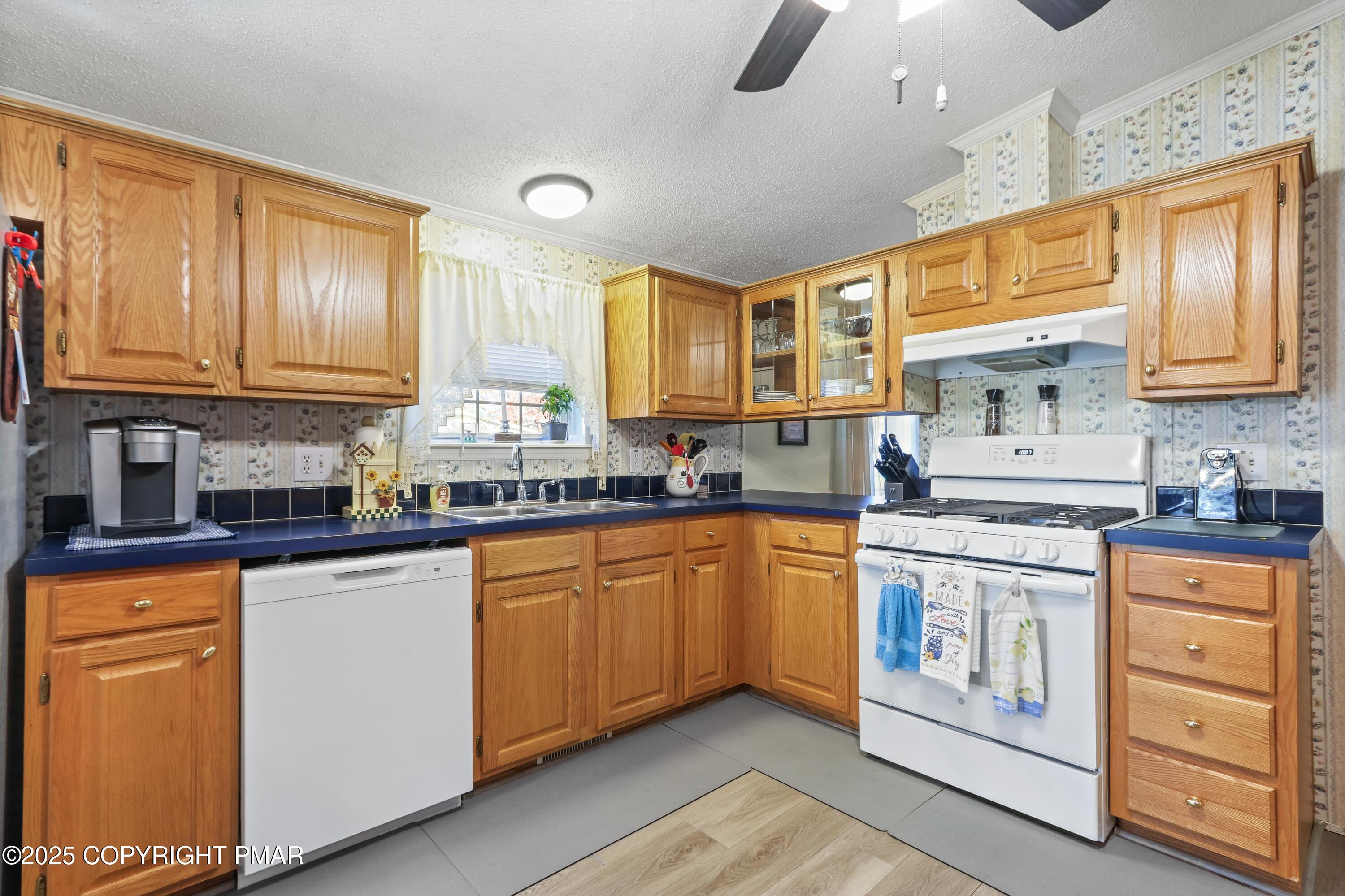 8 Cedar Court Bath, PA 18014 - Photo 13 of 35 a kitchen with stainless steel appliances granite countertop a stove and cabinets