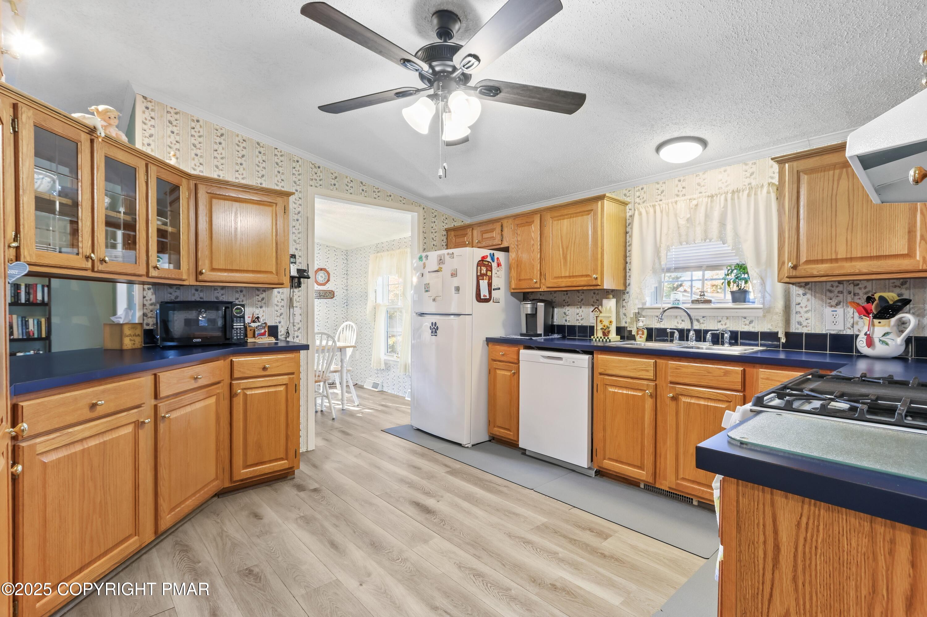 8 Cedar Court Bath, PA 18014 - Photo 14 of 35 a kitchen with stainless steel appliances granite countertop a stove a sink dishwasher and a refrigerator