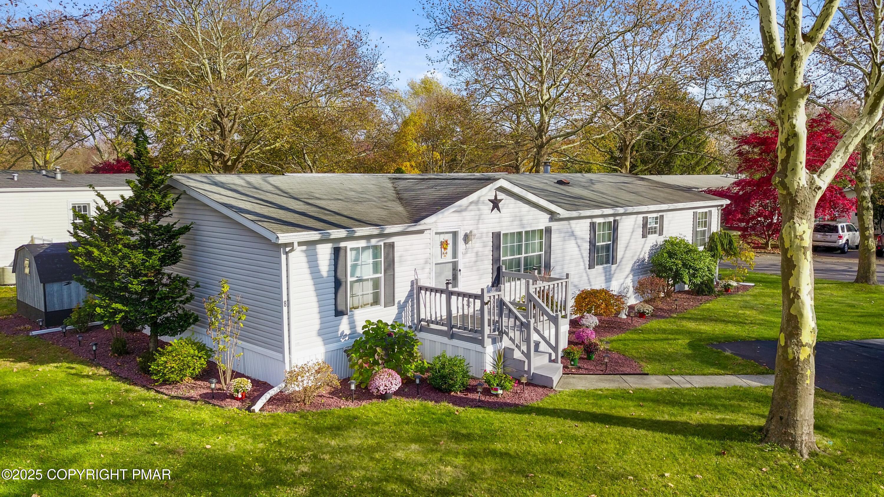 8 Cedar Court Bath, PA 18014 - Photo 2 of 35 a view of a white house with a yard table and chairs