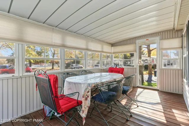 a view of a dining room with furniture window and outside view
