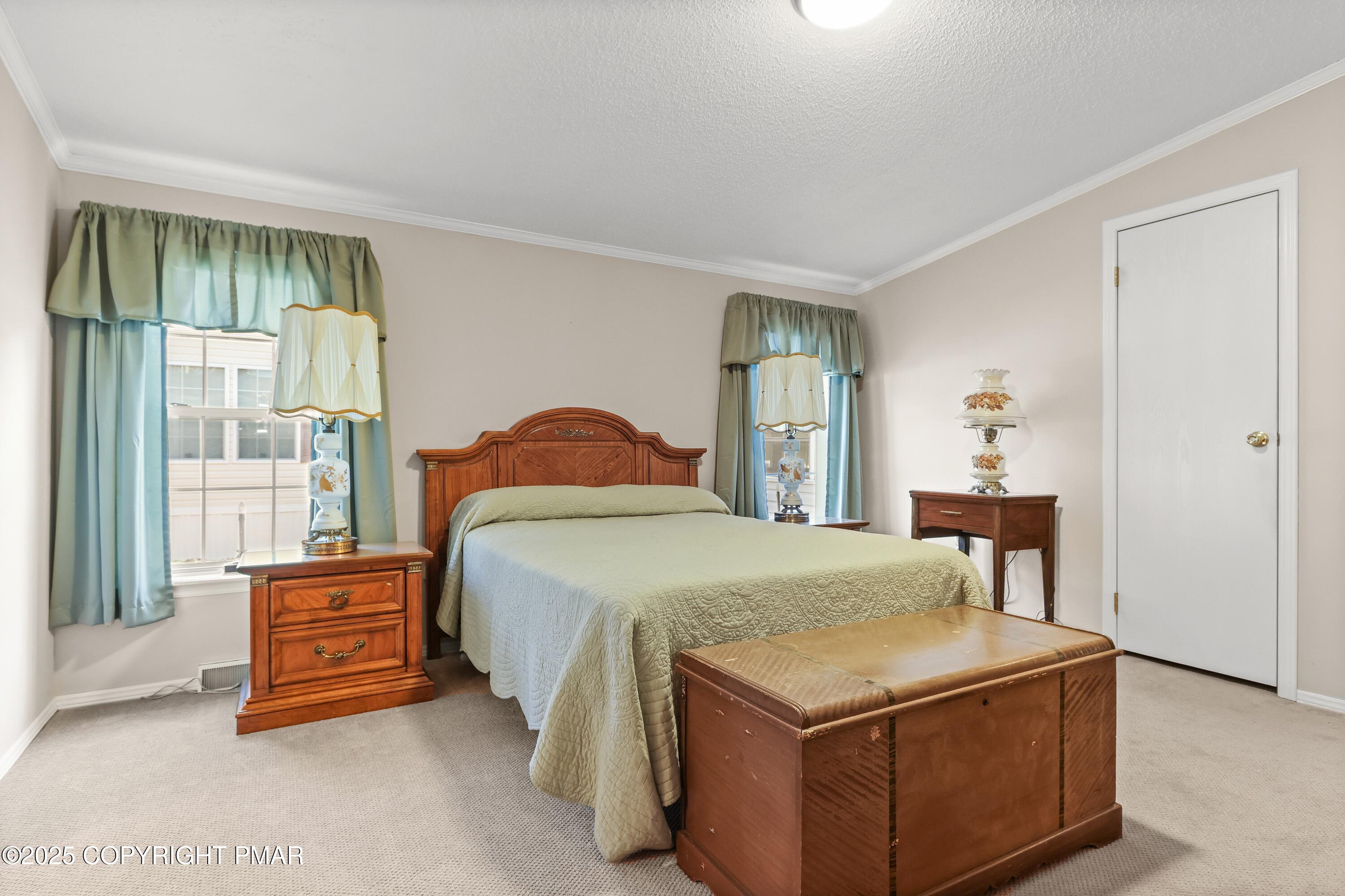 8 Cedar Court Bath, PA 18014 - Photo 23 of 35 a bedroom with a bed and a table in it