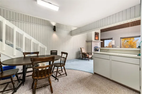 a kitchen with stainless steel appliances white cabinets and a refrigerator
