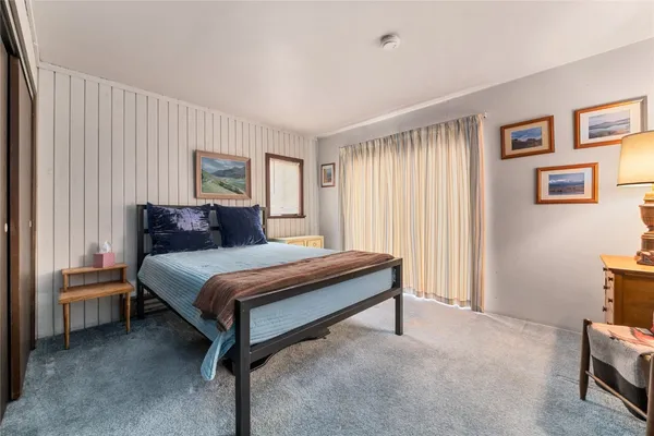 a bedroom with a bed and a cabinets