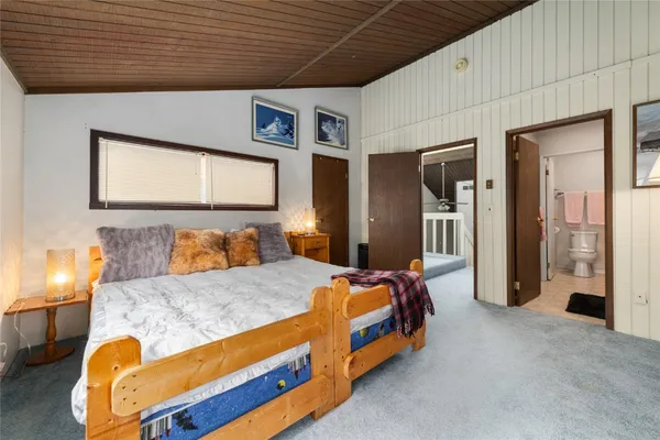 a aerial view of a house with a yard and potted plants
