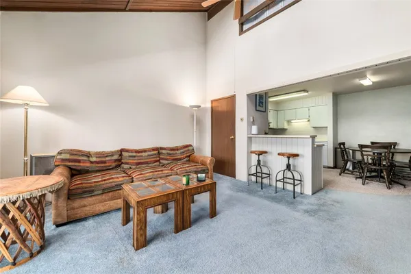 a bed sitting in a room next to a window