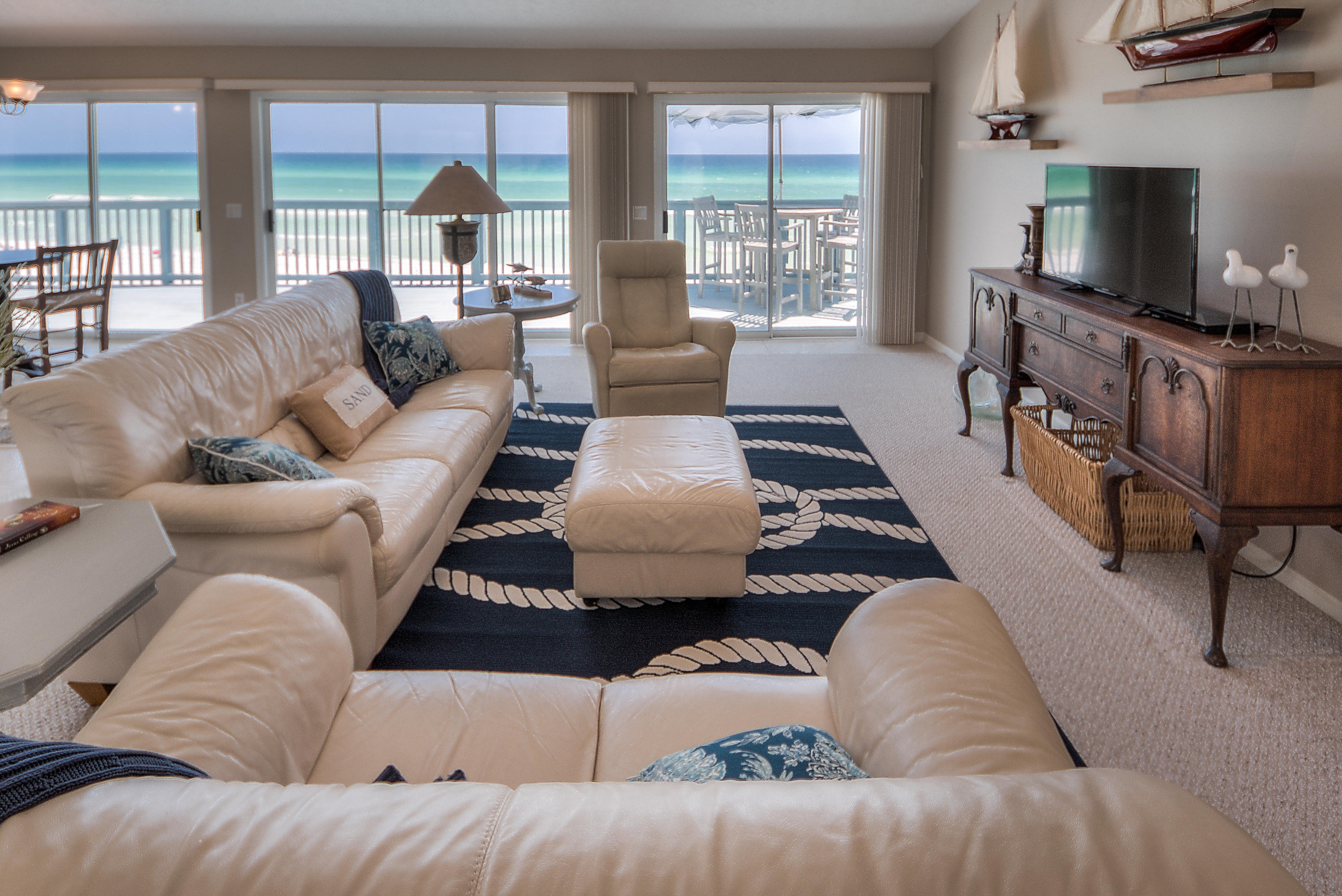 75 Fort Panic Road Santa Rosa Beach, FL 32459 - Photo 2 of 24 a living room with furniture and a flat screen tv
