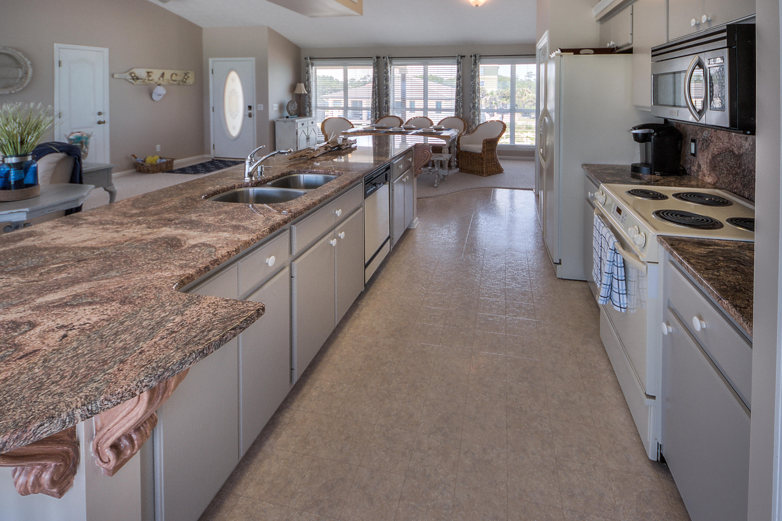 75 Fort Panic Road Santa Rosa Beach, FL 32459 - Photo 9 of 24 a kitchen with stainless steel appliances granite countertop a lot of counter space