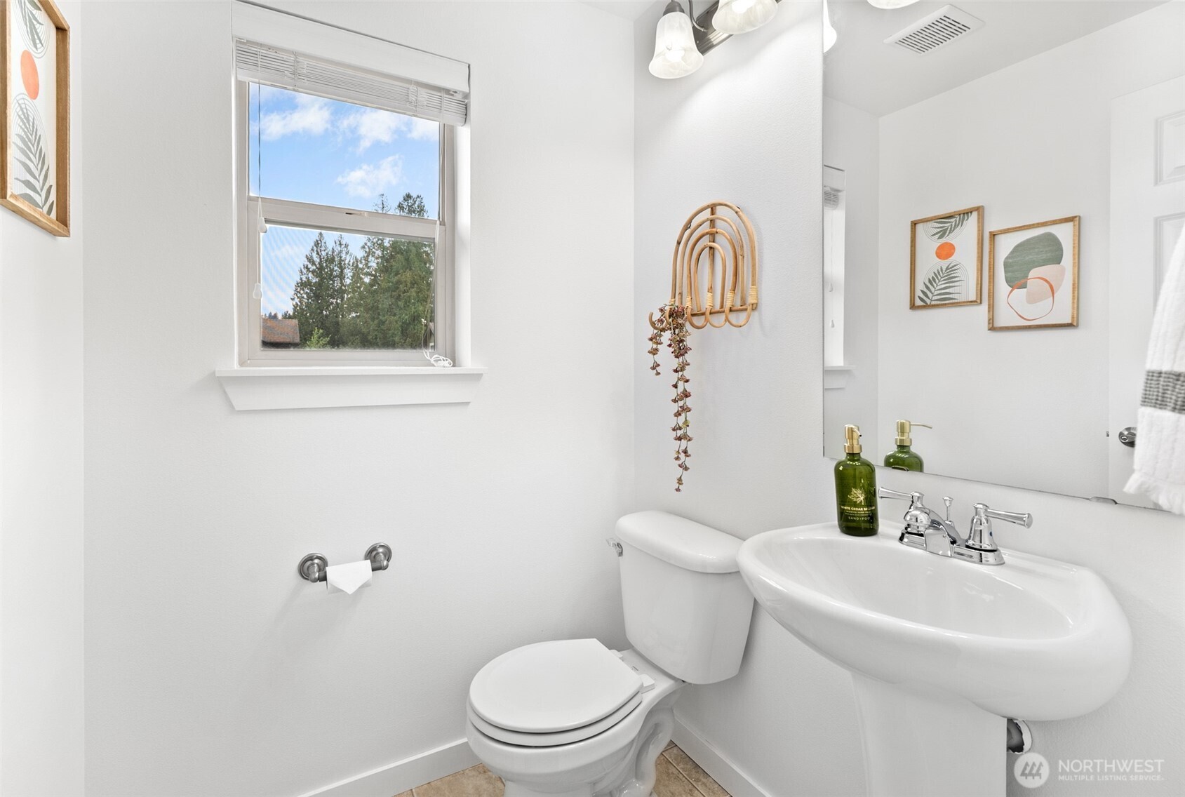 1900 Weaver Road, Unit G103 Snohomish, WA 98290 - Photo 7 of 17 a bathroom with a toilet a sink and mirror