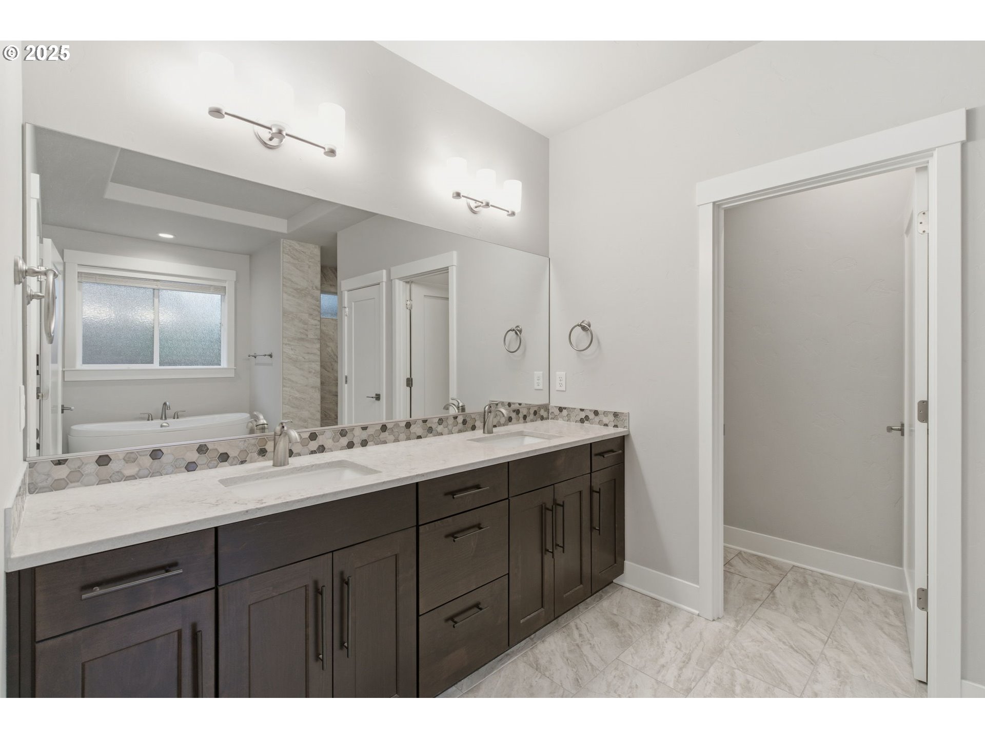 3228 Northwest Hood Court Camas, WA 98607 - Photo 13 of 28 a bathroom with a double vanity sink and mirror