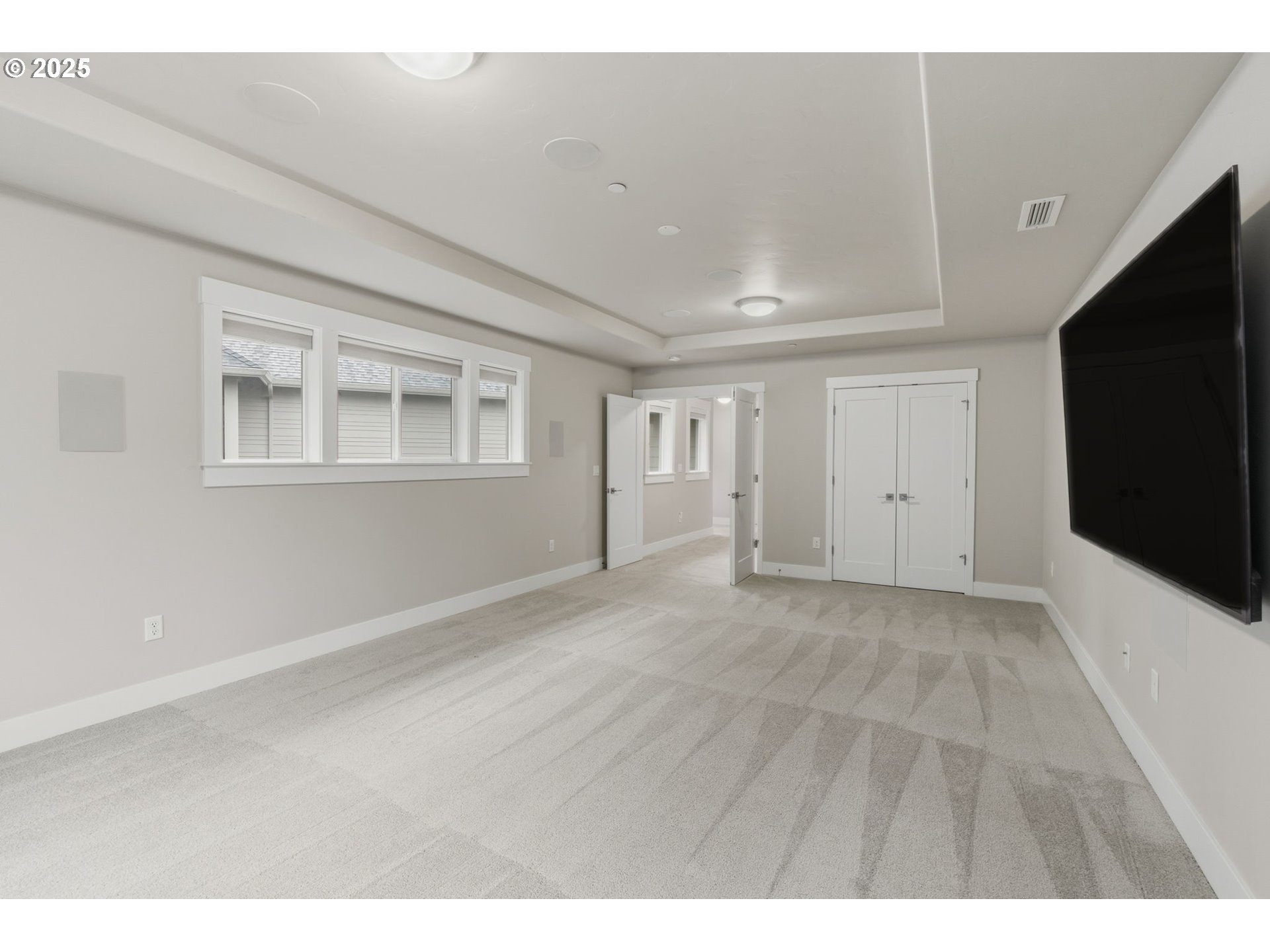 3228 Northwest Hood Court Camas, WA 98607 - Photo 23 of 28 a view of an empty room with wooden floor and a window