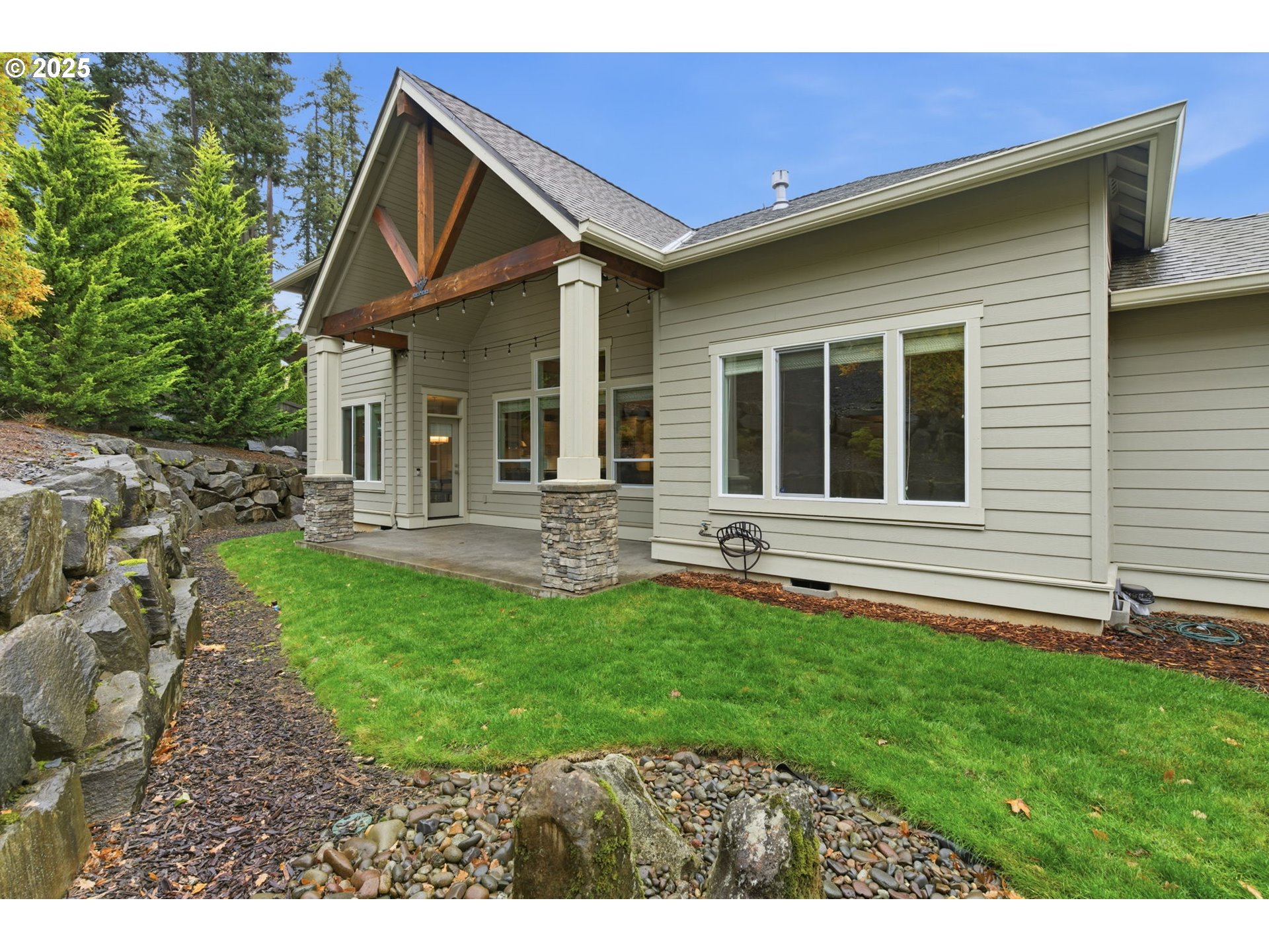 3228 Northwest Hood Court Camas, WA 98607 - Photo 24 of 28 a backyard of a house with seating space