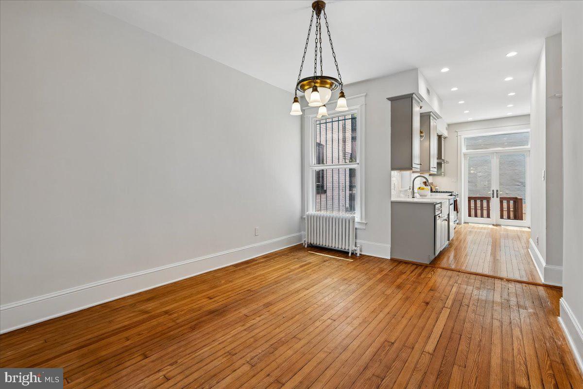 1105 G Street Southeast Washington, DC 20003 - Photo 16 of 51 Bright, open Living room, vintage light fixture