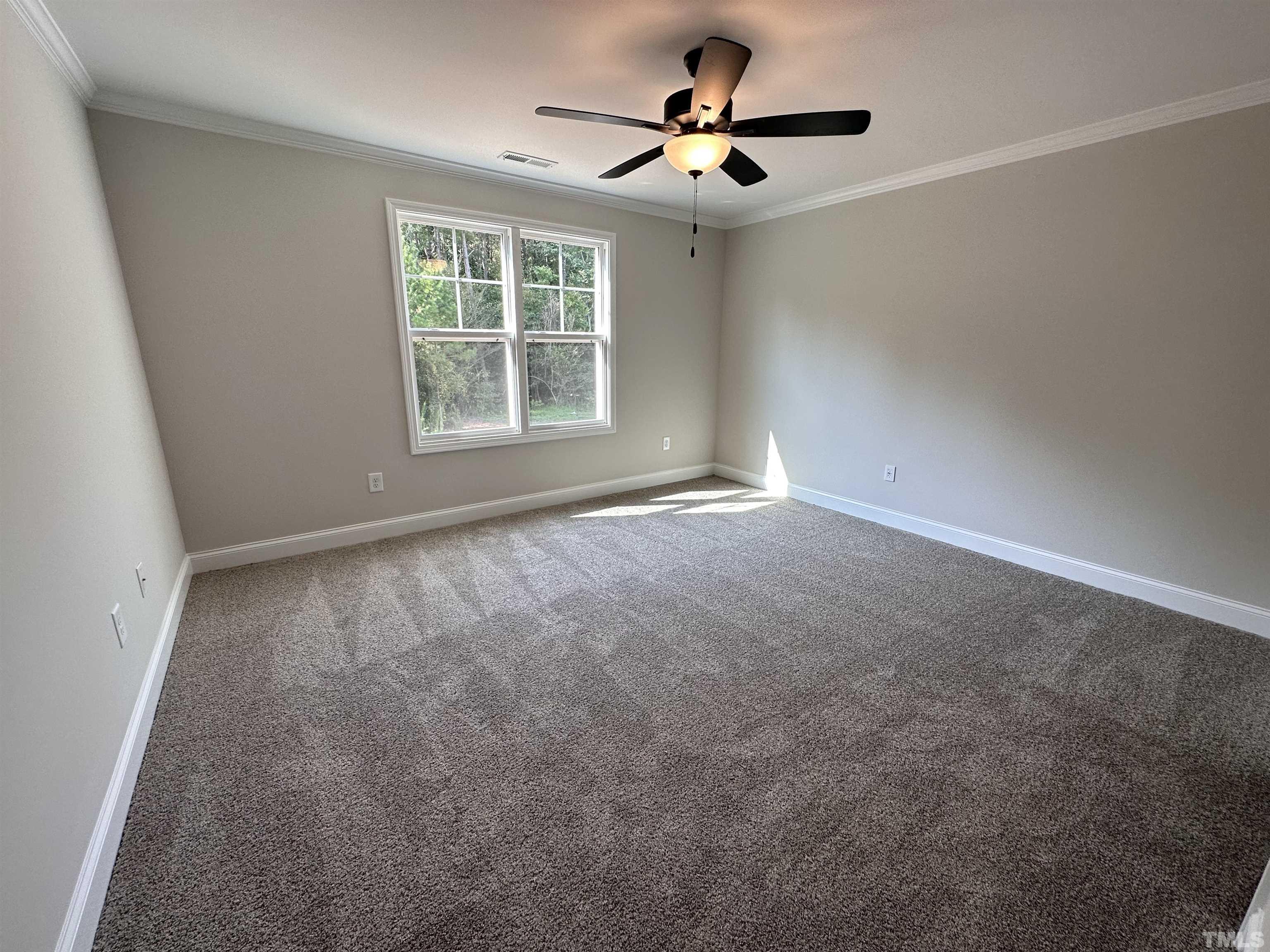 386 Jackson Pond Drive Smithfield, NC 27577 - Photo 8 of 10 a view of an empty room with a window