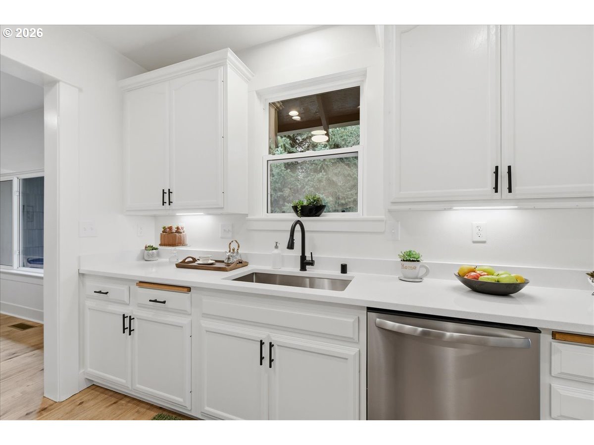 1313 Hining Road Winlock, WA 98596 - Photo 15 of 46 a kitchen with a sink and cabinets