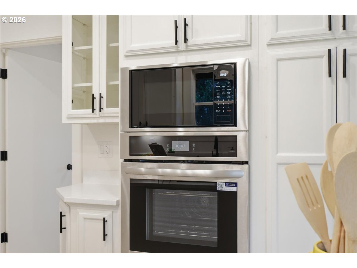 1313 Hining Road Winlock, WA 98596 - Photo 17 of 46 a kitchen with a stove and a microwave