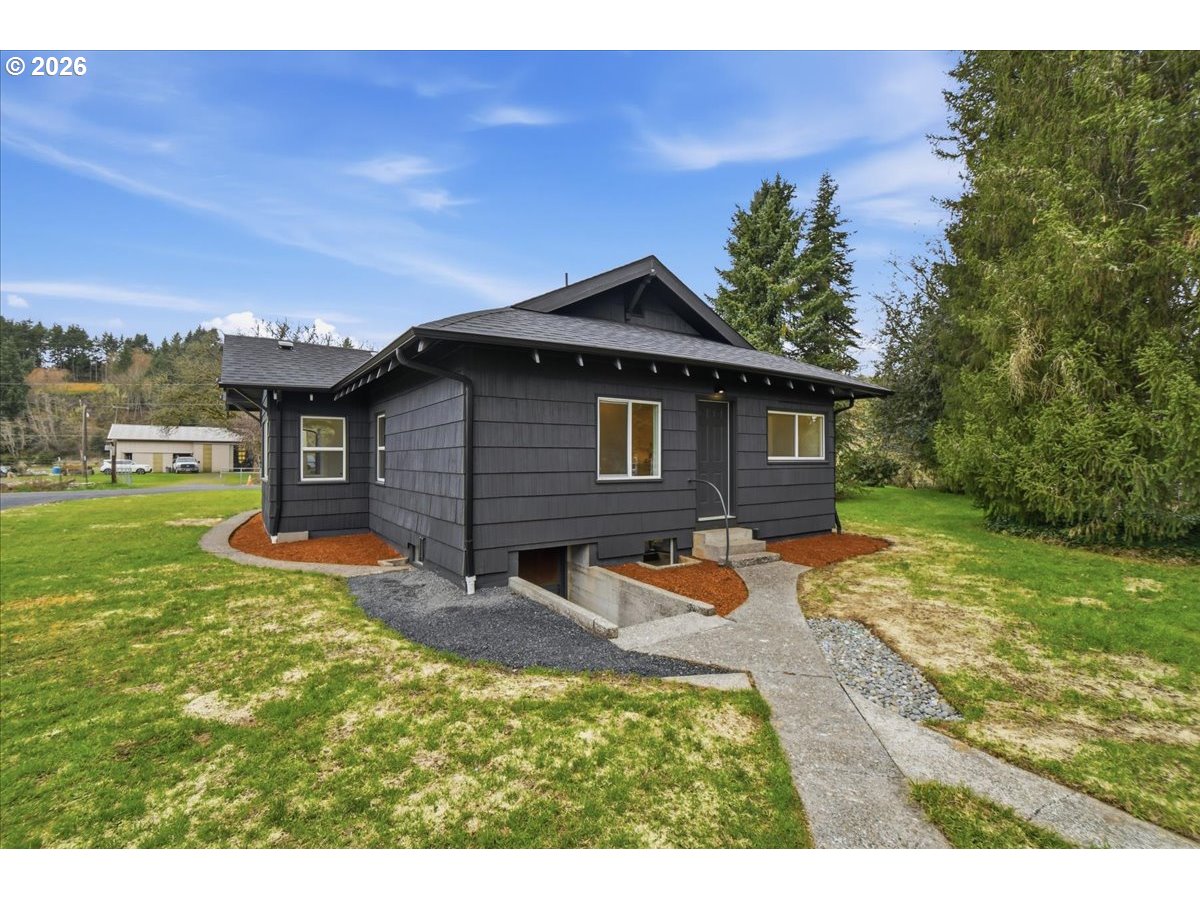 1313 Hining Road Winlock, WA 98596 - Photo 30 of 46 a backyard of a house with table and chairs