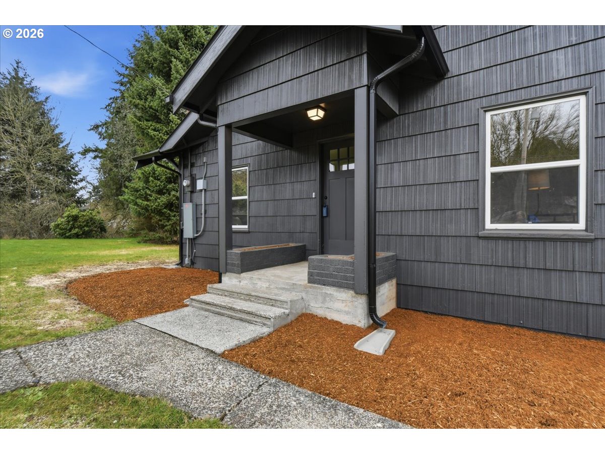 1313 Hining Road Winlock, WA 98596 - Photo 4 of 46 a house view with a backyard space