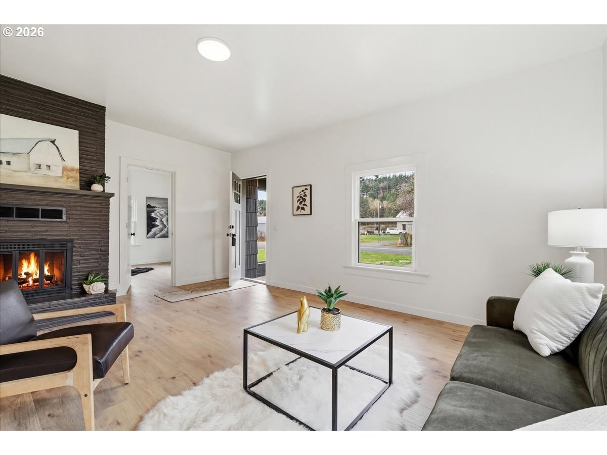 1313 Hining Road Winlock, WA 98596 - Photo 7 of 46 a living room with furniture and a fireplace