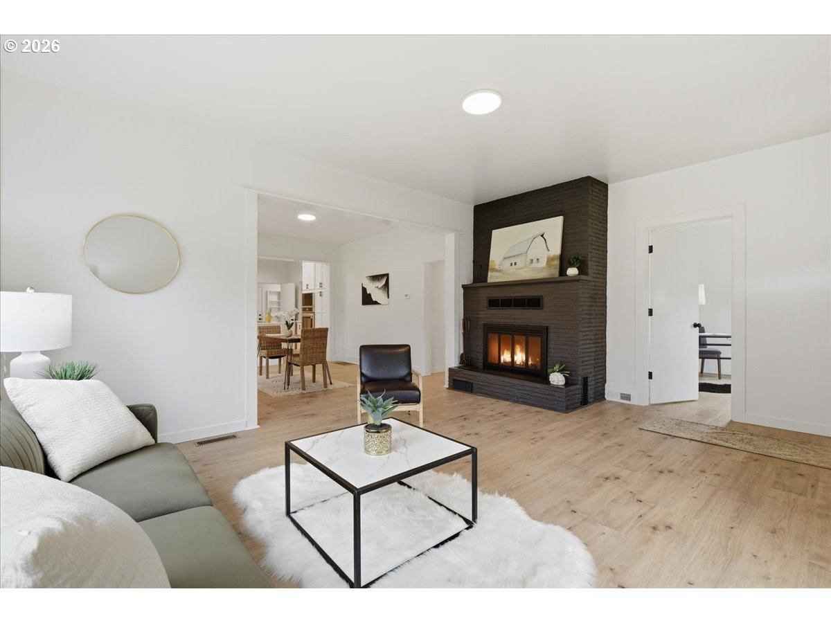1313 Hining Road Winlock, WA 98596 - Photo 8 of 46 a living room with furniture and a fireplace