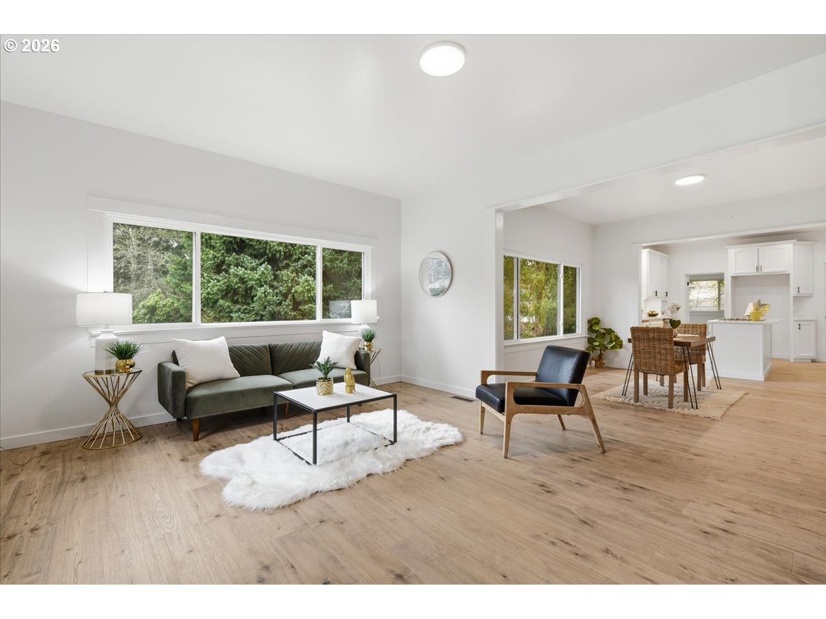 1313 Hining Road Winlock, WA 98596 - Photo 9 of 46 a living room with furniture and a wooden floor