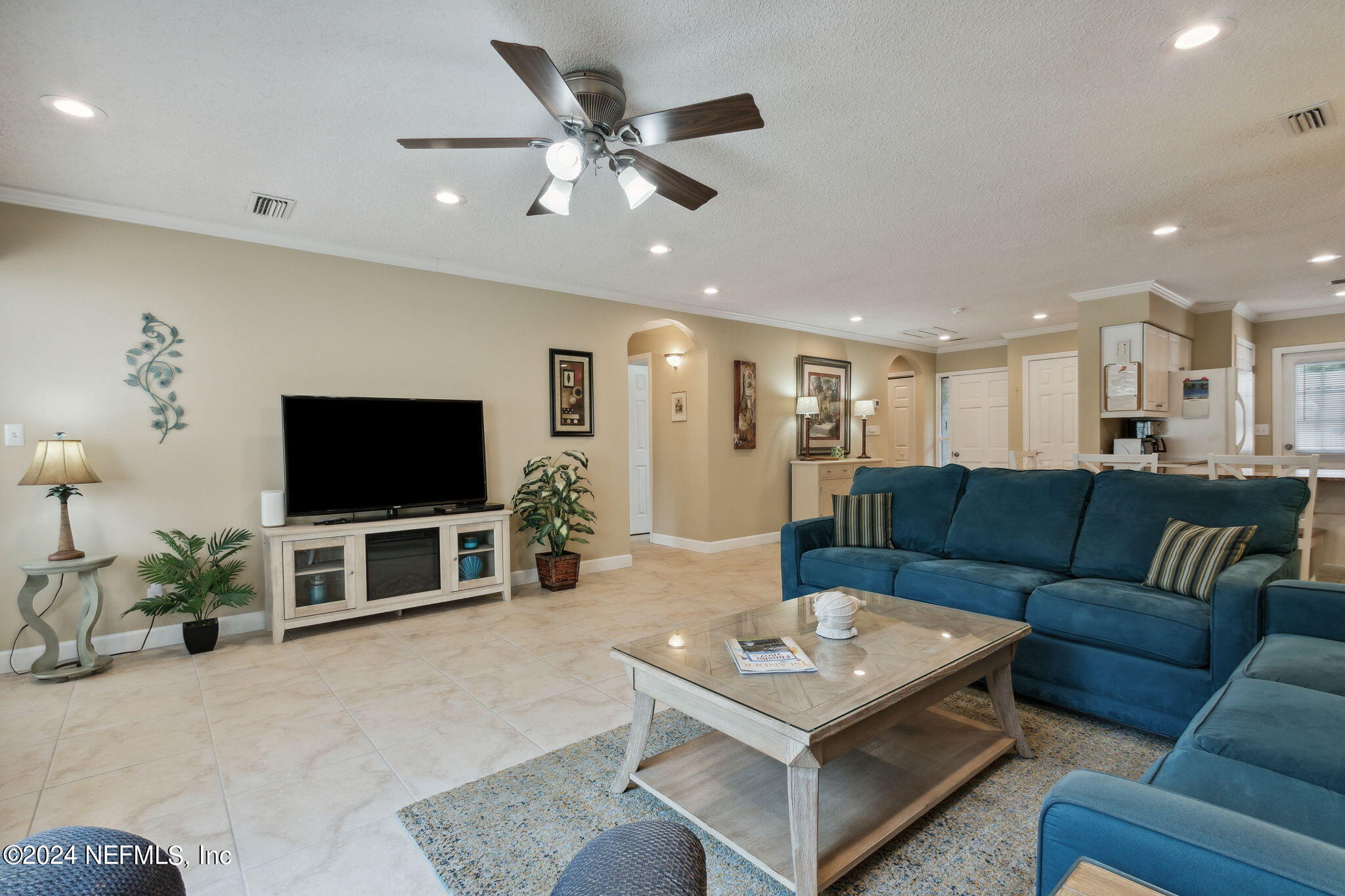 3327 Sea Marsh Road Fernandina Beach, FL 32034 - Photo 13 of 39 a living room with furniture and a flat screen tv