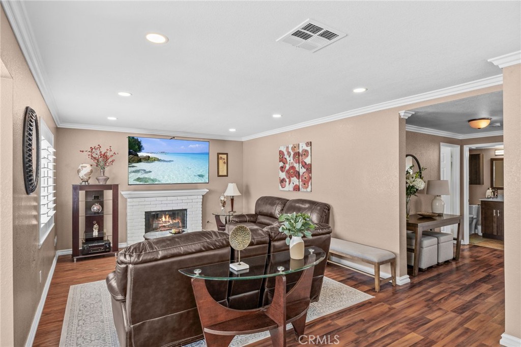 20257 Edmund Road Riverside, CA 92508 - Photo 17 of 53 a living room with furniture a fireplace and a table