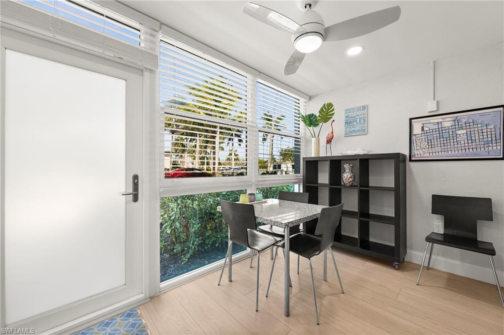 1021 3rd Street South, Unit 108 Naples, FL 34102 - Photo 15 of 31 a view of a dining room with furniture and a window