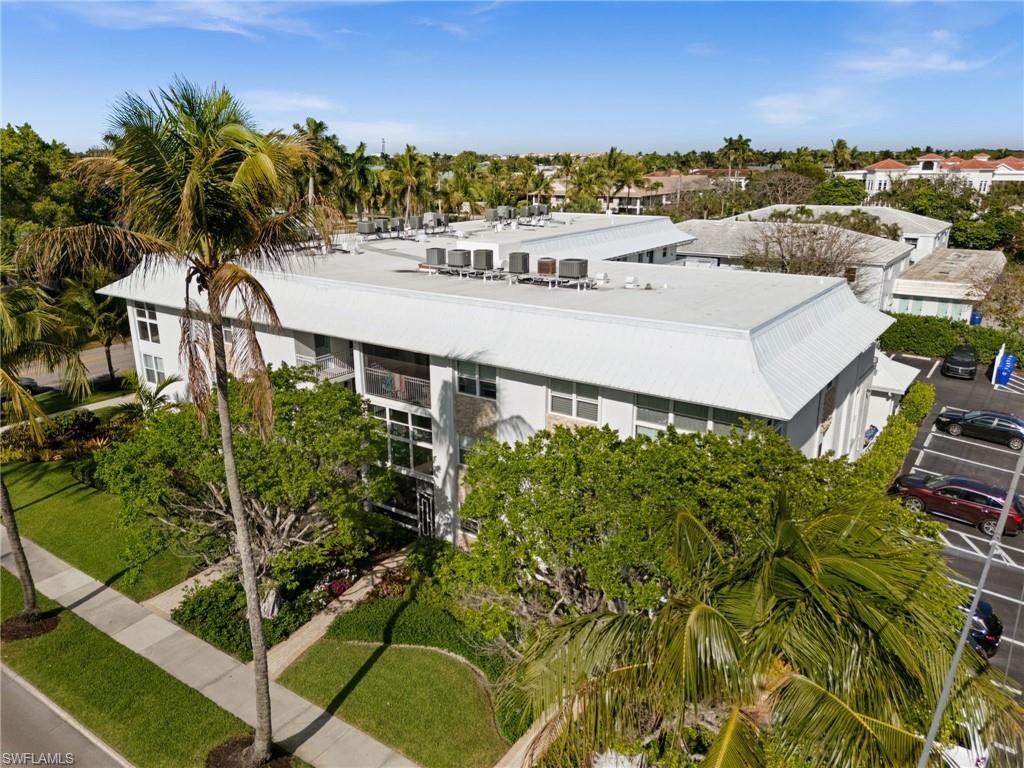 1021 3rd Street South, Unit 108 Naples, FL 34102 - Photo 2 of 31 a picture of houses with yard