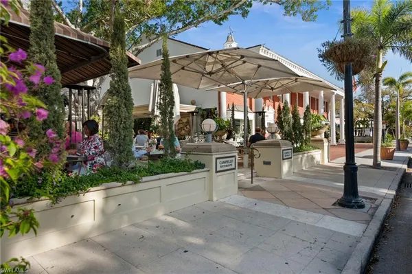 a view of a chairs and table in a patio