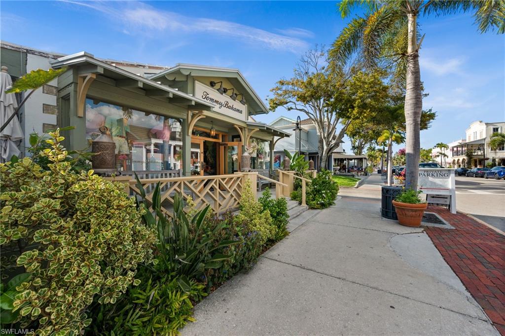 1021 3rd Street South, Unit 108 Naples, FL 34102 - Photo 27 of 31 a view of a street with potted plants