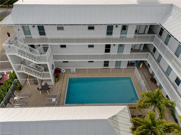 a view of swimming pool with a outdoor seating