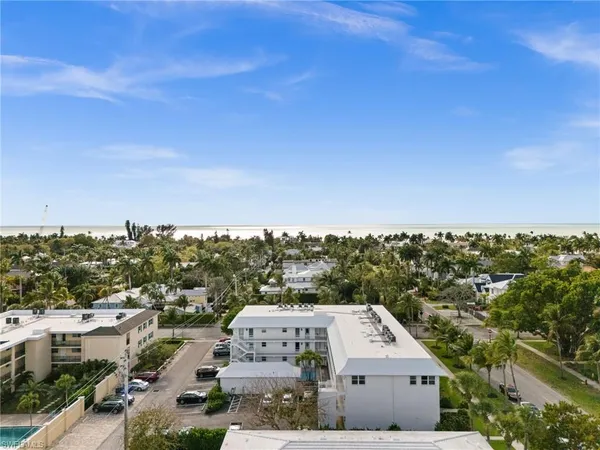 a kitchen with stainless steel appliances white cabinets and a refrigerator