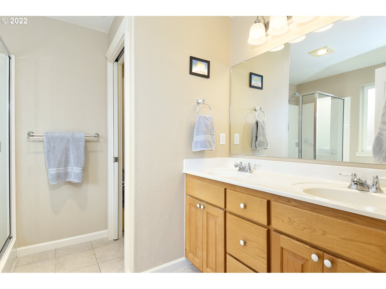 829 T Street Springfield, OR 97477 - Photo 14 of 20 a bathroom with a sink double vanity and a mirror