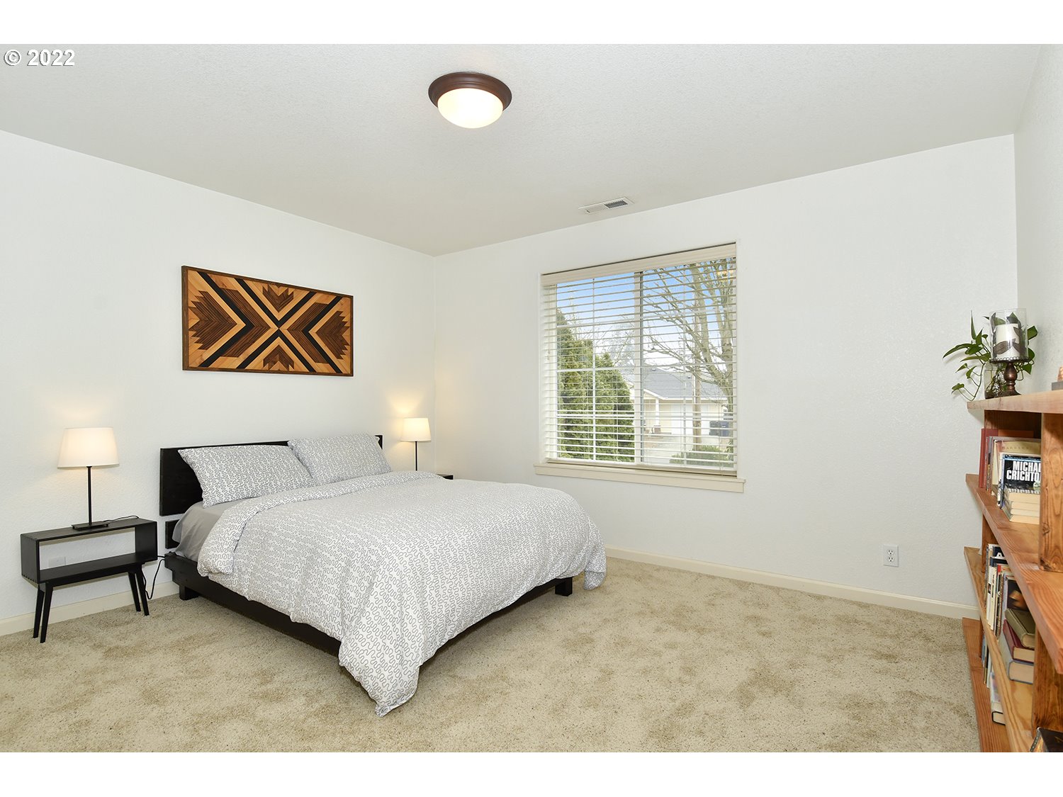 829 T Street Springfield, OR 97477 - Photo 16 of 20 a bedroom with a bed and a painting on the wall