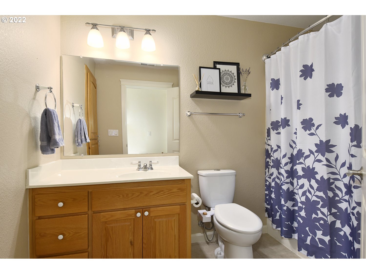 829 T Street Springfield, OR 97477 - Photo 17 of 20 a bathroom with a granite countertop toilet sink and mirror
