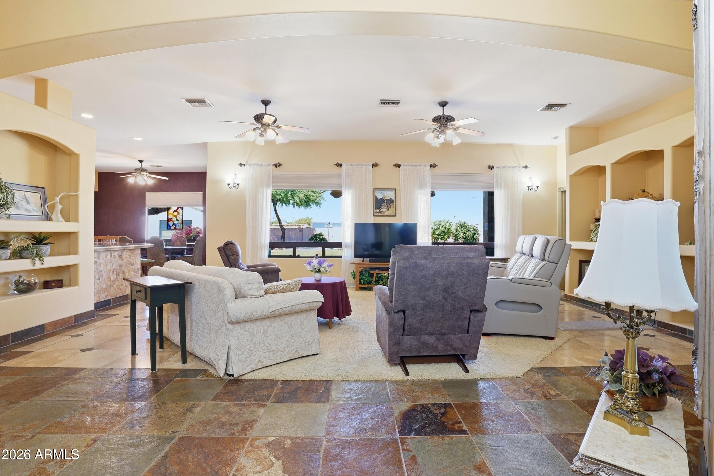6334 East Albany Street Mesa, AZ 85205 - Photo 12 of 72 a living room with furniture and wooden floor