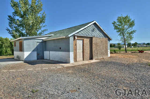 1190-18 18 1/2 Road Fruita, CO 81521 - Photo 31 of 35 a view of a house with a yard and potted plants