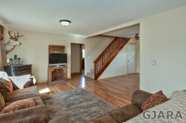 1190-18 18 1/2 Road Fruita, CO 81521 - Photo 5 of 35 a living room with furniture and a wooden floor