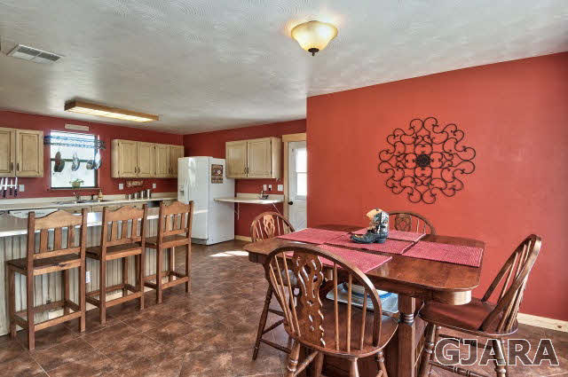 1190-18 18 1/2 Road Fruita, CO 81521 - Photo 9 of 35 a view of a dining room with furniture