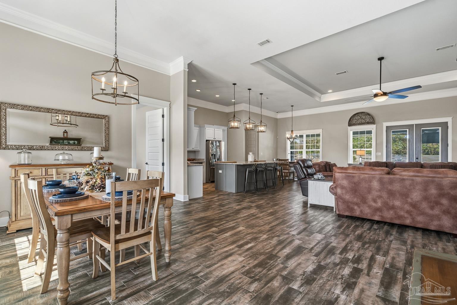 3550 Molino Road Molino, FL 32577 - Photo 11 of 68 a view of a dining room with furniture window and wooden floor