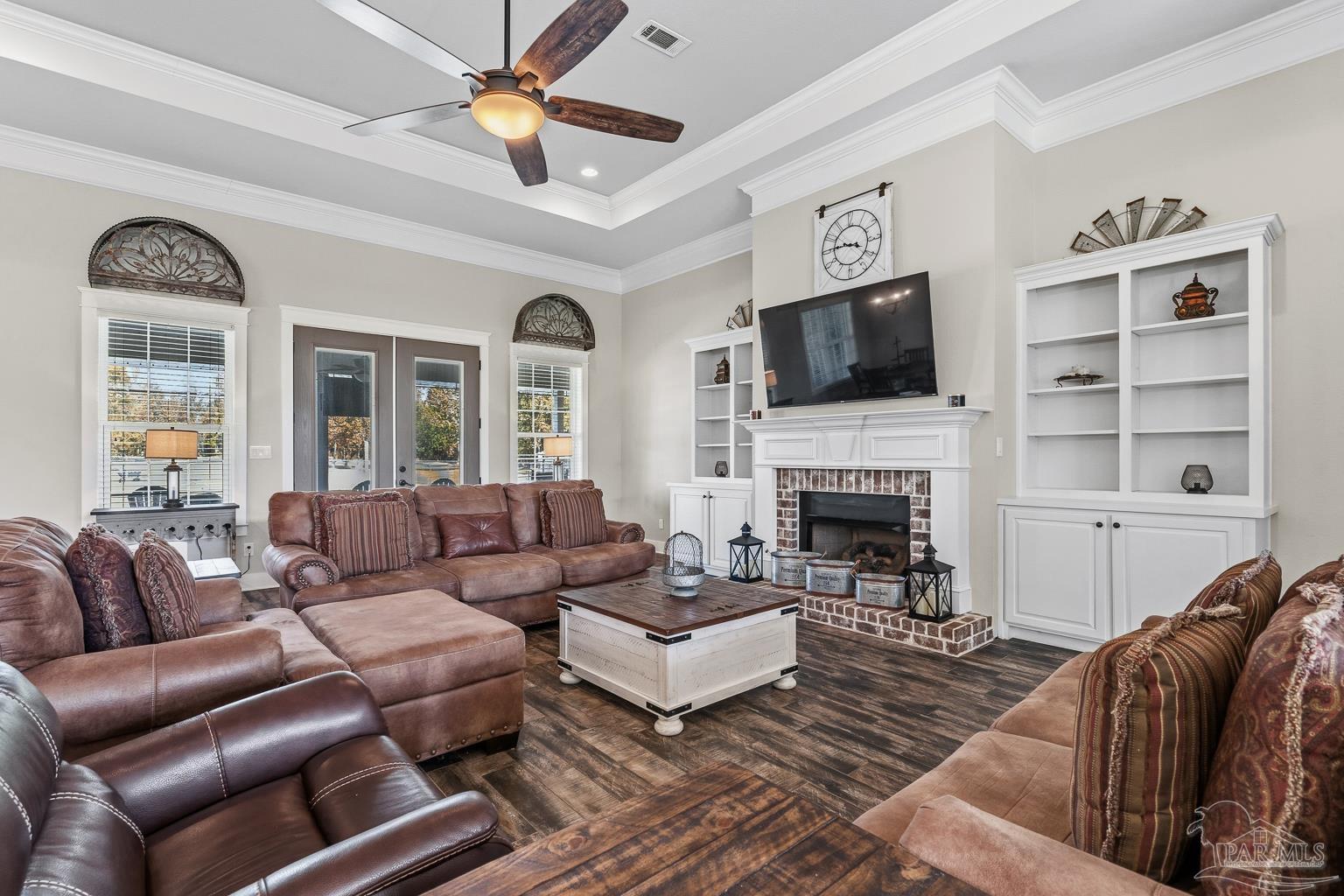 3550 Molino Road Molino, FL 32577 - Photo 14 of 68 a living room with furniture a flat screen tv and a fireplace