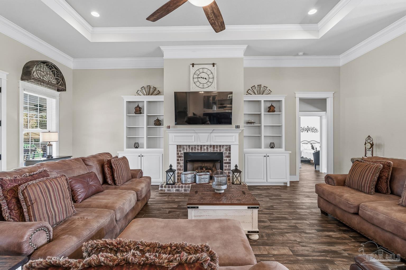 3550 Molino Road Molino, FL 32577 - Photo 15 of 68 a living room with furniture a flat screen tv and a fireplace