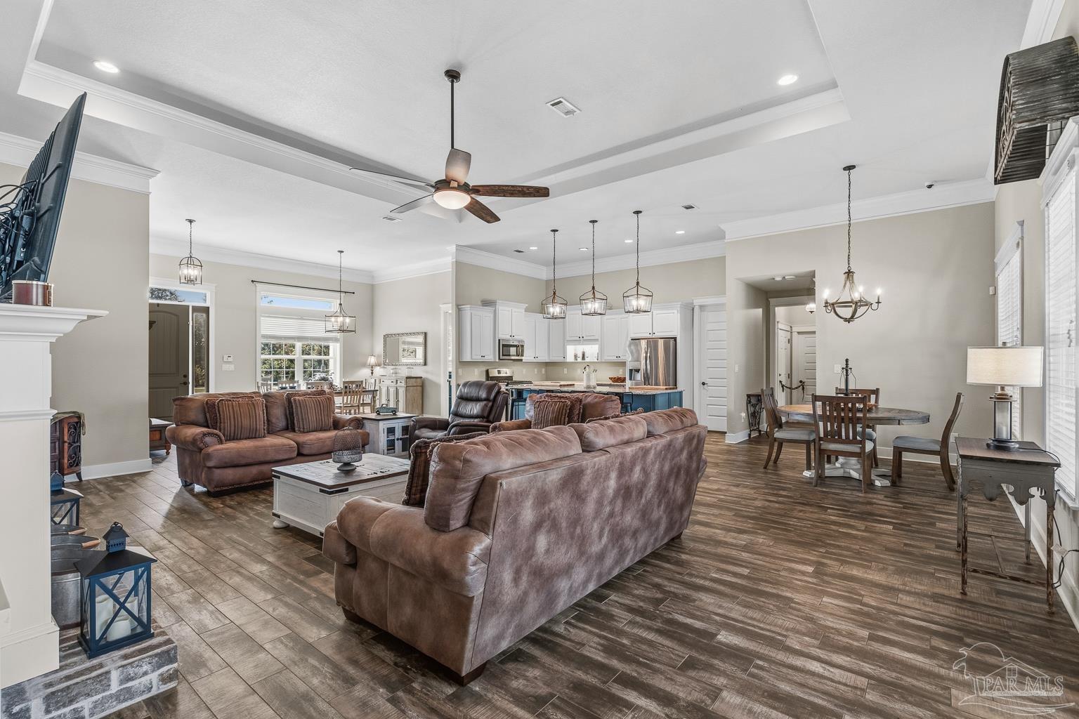 3550 Molino Road Molino, FL 32577 - Photo 17 of 68 a living room with furniture and a chandelier