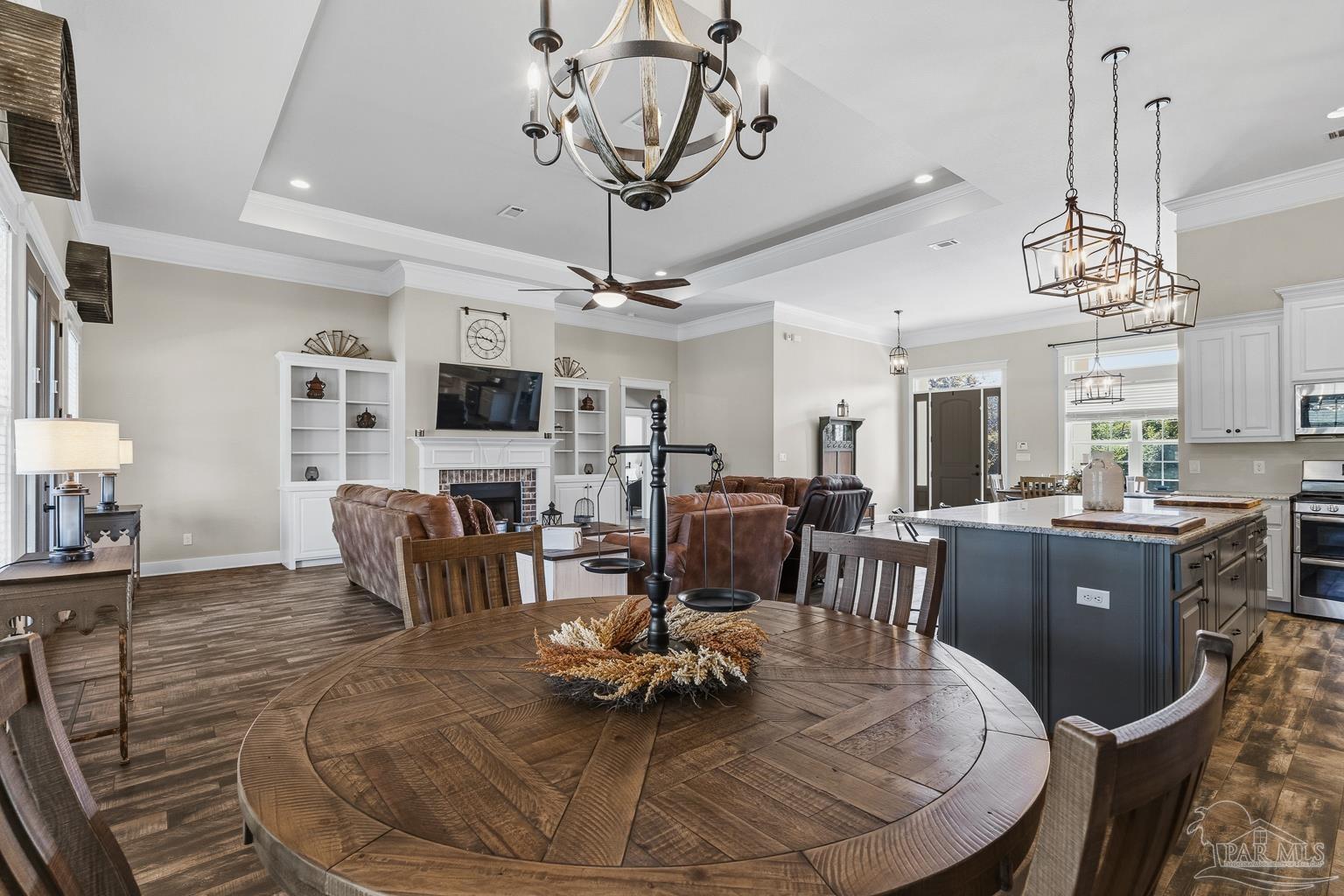 3550 Molino Road Molino, FL 32577 - Photo 24 of 68 a living room with furniture and a chandelier