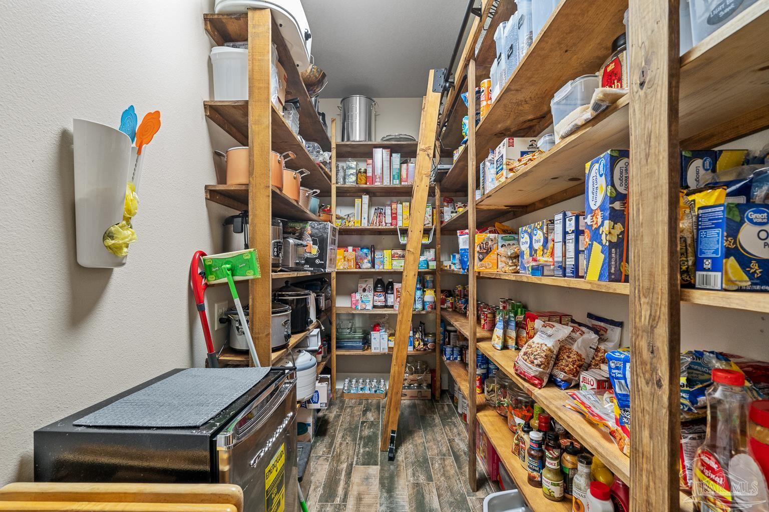 3550 Molino Road Molino, FL 32577 - Photo 25 of 68 a view of living room with furniture and book shelf